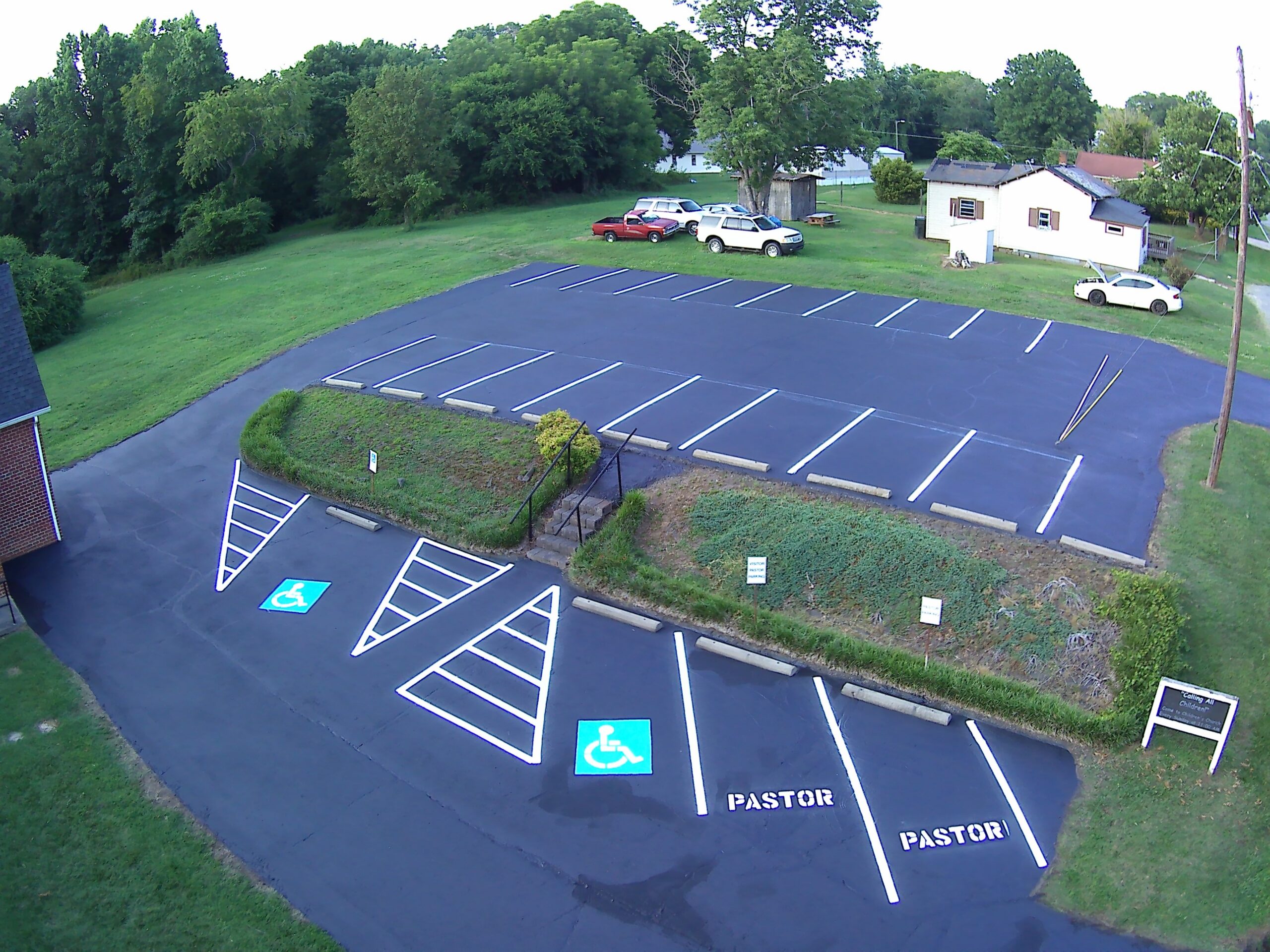 Aerial view of church parking lot with fresh line striping by Primescape Solutions